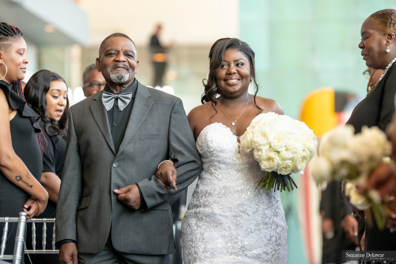Walking down the aisle with her father, Gene Smith